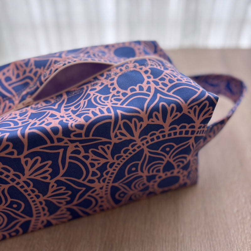 Blue and pink patterned bag on a wooden surface