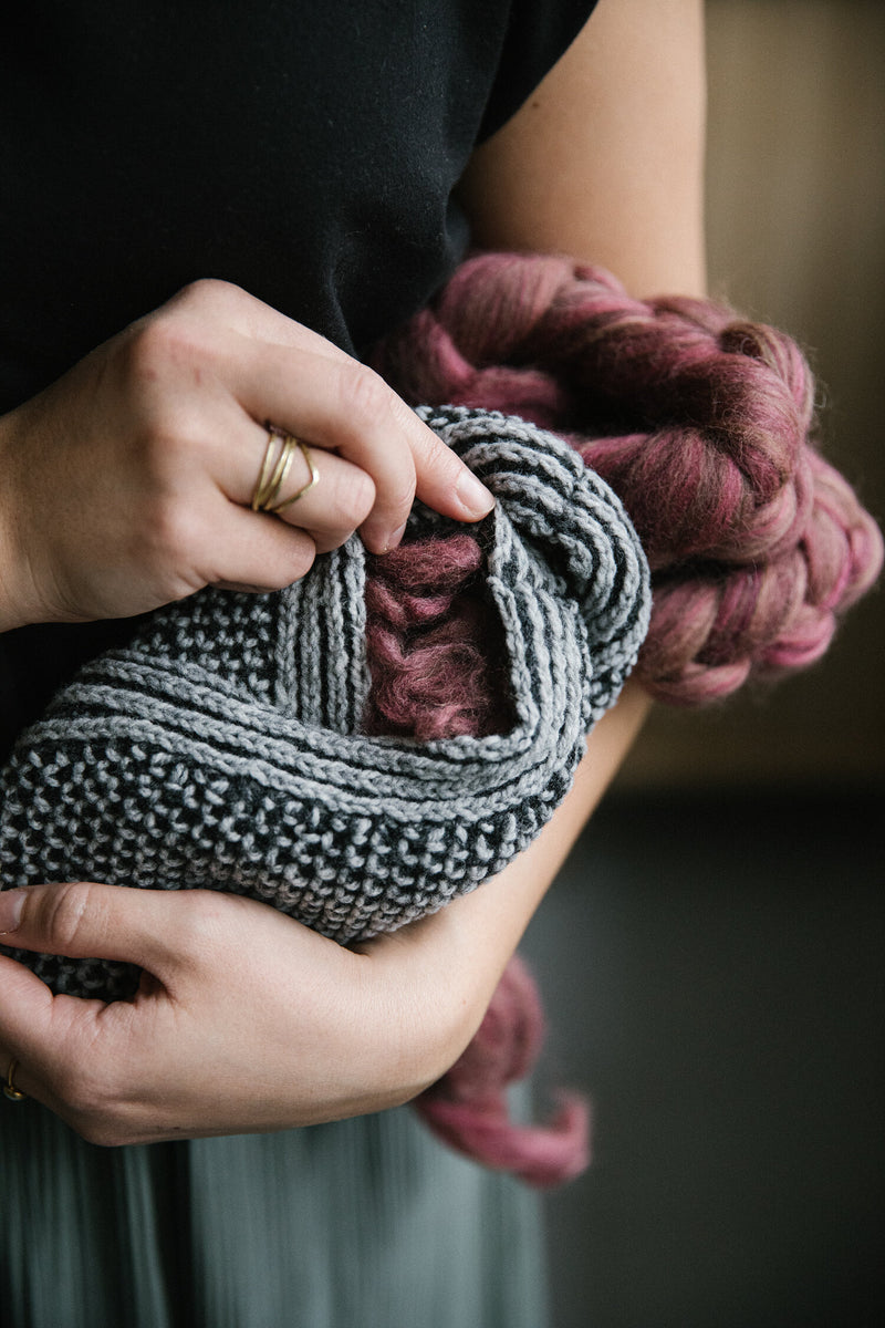 textured grey and black sock slippers filled with burgundy roving